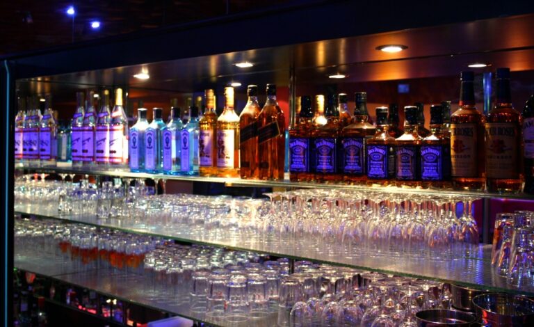 Bar area of Tagblatt Showclub in Innsbruck, Austria, featuring a well-stocked selection of beverages, dim lighting, and a vibrant atmosphere complementing the club's table dance performances Bar area of Tagblatt Showclub in Innsbruck, Austria, featuring a well-stocked selection of beverages, dim lighting, and a vibrant atmosphere complementing the club's table dance performances