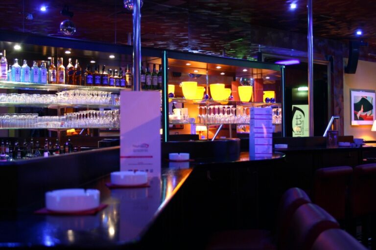 Interior of Tagblatt Showclub in Innsbruck, Austria, featuring dim lighting, comfortable seating, and a vibrant atmosphere designed for table dance performances Interior of Tagblatt Showclub in Innsbruck, Austria, featuring dim lighting, comfortable seating, and a vibrant atmosphere designed for table dance performances