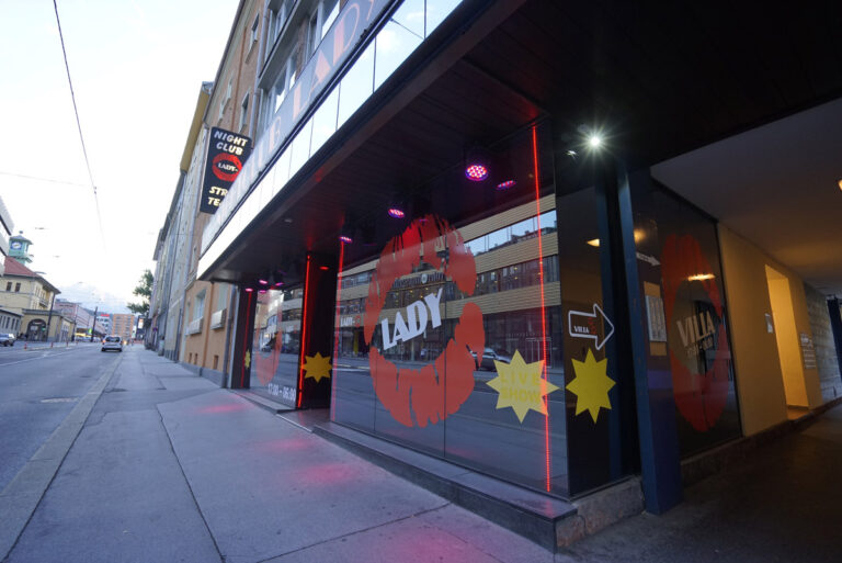 Exterior view of Lady-O nightclub in Innsbruck, Austria, featuring a sleek modern entrance with illuminated signage Exterior view of Lady-O nightclub in Innsbruck, Austria, featuring a sleek modern entrance with illuminated signage