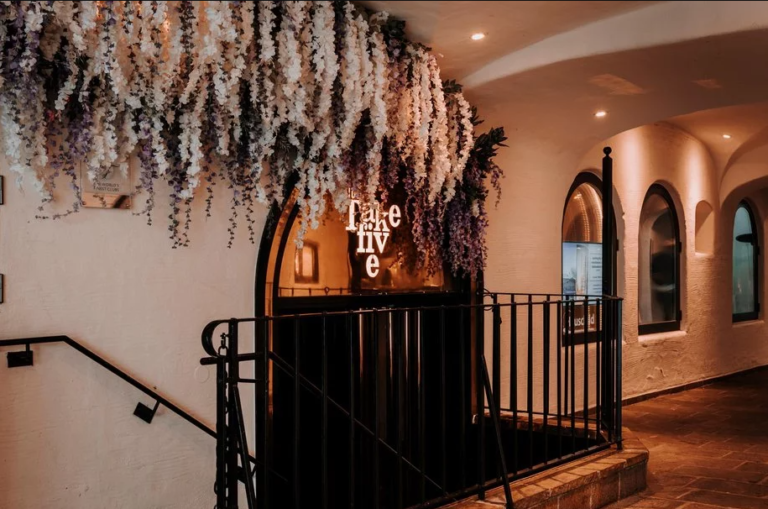 Exterior view of Club Take Five Kitzbühel, showcasing its prominent entrance in the heart of Kitzbühel