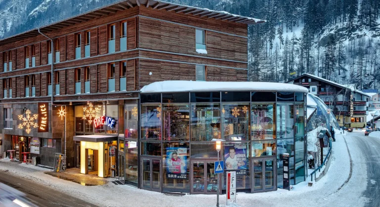 Exterior view of Fire & Ice nightclub in Sölden, Austria, featuring a modern glass façade illuminated by neon signage, located on Dorfstraße 58 in the heart of Sölden's après-ski district Exterior view of Fire & Ice nightclub in Sölden, Austria, featuring a modern glass façade illuminated by neon signage, located on Dorfstraße 58 in the heart of Sölden's après-ski district