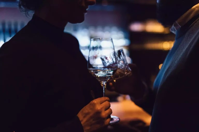Guests savoring glasses of Austrian Sekt at Skybar 2.100 Schöne Aussicht in Hochsölden, Austria, amidst a chic alpine interior with panoramic views of the Ötztal Alps Guests savoring glasses of Austrian Sekt at Skybar 2.100 Schöne Aussicht in Hochsölden, Austria, amidst a chic alpine interior with panoramic views of the Ötztal Alps