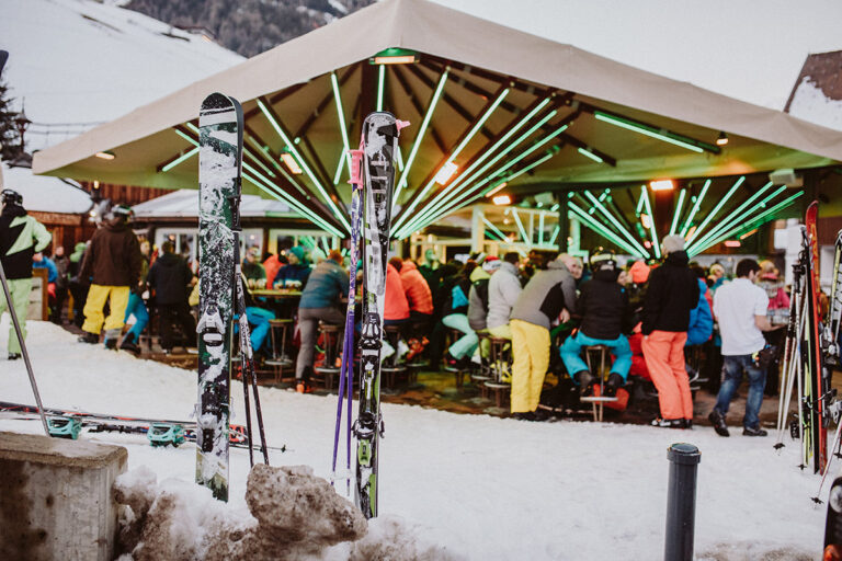 Exterior view of Marco's Sölden, a vibrant après-ski bar and restaurant located on Dorfstraße 80 in the heart of Sölden, Austria, featuring a distinctive fold-down roof and a spacious sun terrace Exterior view of Marco's Sölden, a vibrant après-ski bar and restaurant located on Dorfstraße 80 in the heart of Sölden, Austria, featuring a distinctive fold-down roof and a spacious sun terrace